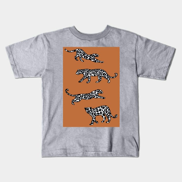 Leopard Shapes Pattern, Black and White, on Burnt Orange Kids T-Shirt by OneThreeSix